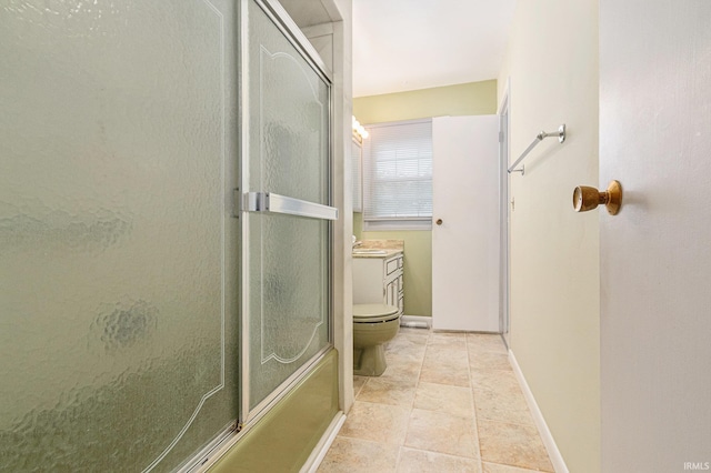 full bath with a shower with shower door, toilet, vanity, baseboards, and tile patterned flooring