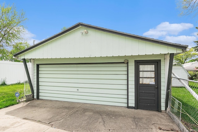 detached garage with fence