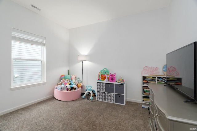 recreation room with carpet flooring and baseboards