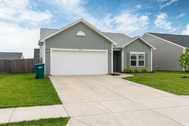 view of front of property with driveway, a garage, and a shingled roof