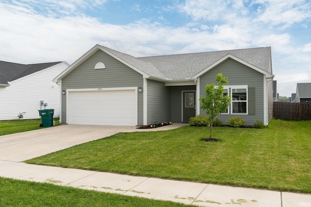 view of front of home featuring an attached garage, driveway, and a shingled roof