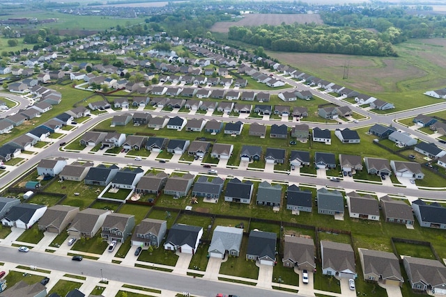 aerial view of property and surrounding area with nearby suburban area