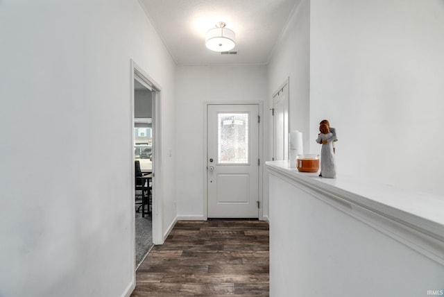 entryway featuring dark wood finished floors and baseboards