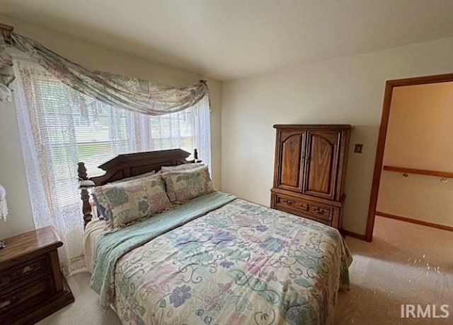 bedroom with light carpet