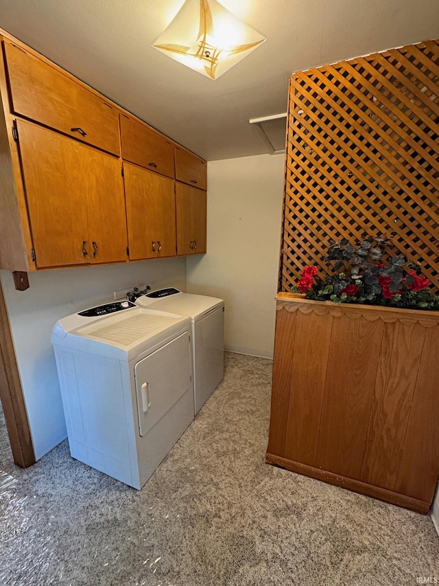 laundry room with cabinet space and washer and clothes dryer