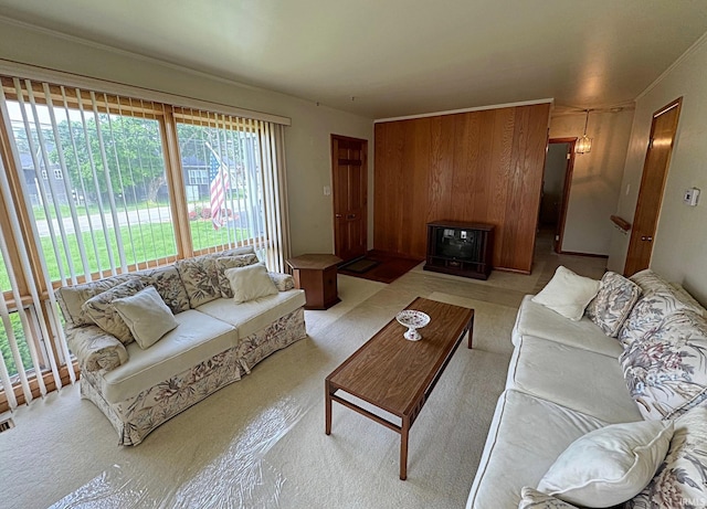 living room featuring light colored carpet and ornamental molding