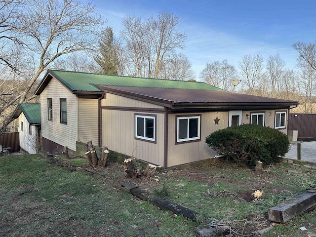 15850-2 Witt Rd, Shoals, IN 47581 - view of property exterior with metal roof and a yard
