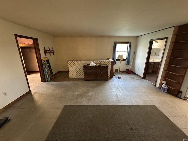 15850-2 Witt Rd, Shoals, IN 47581 - bedroom featuring ensuite bath, baseboards, and a walk in closet