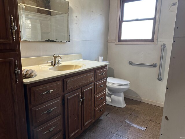 15850-2 Witt Rd, Shoals, IN 47581 - bathroom featuring a shower, toilet, vanity, and baseboards