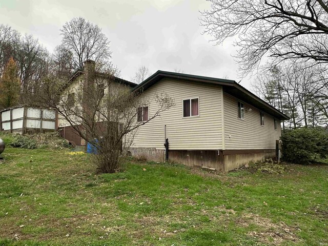 15850-2 Witt Rd, Shoals, IN 47581 - view of side of home featuring a lawn