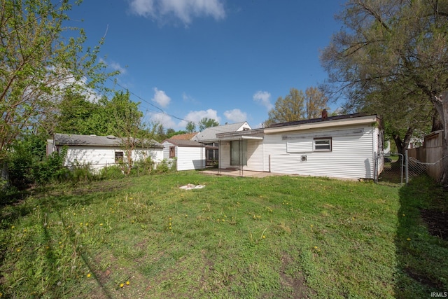 rear view of property featuring a patio