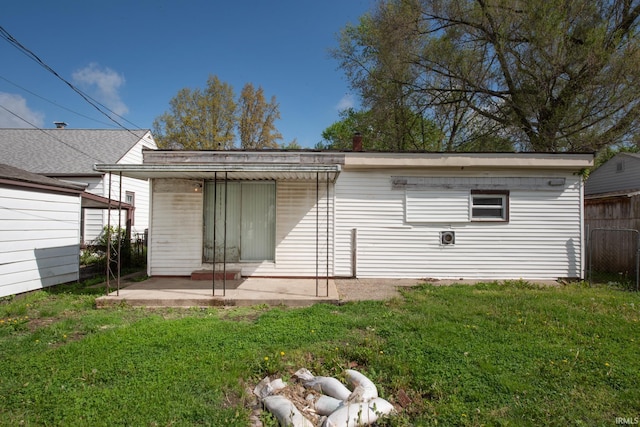 back of house with a patio