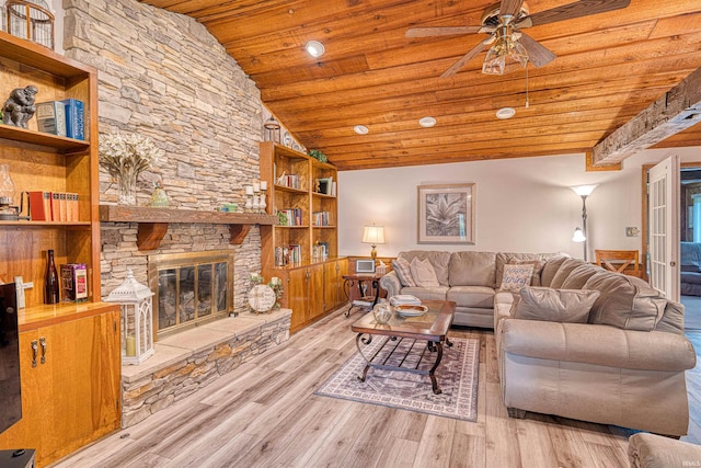 living room with wooden ceiling, ceiling fan, wood finished floors, a fireplace, and lofted ceiling