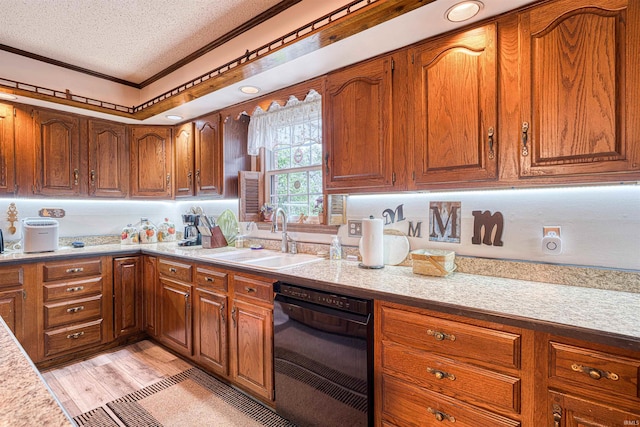 kitchen featuring a sink, a textured ceiling, ornamental molding, brown cabinets, and light countertops