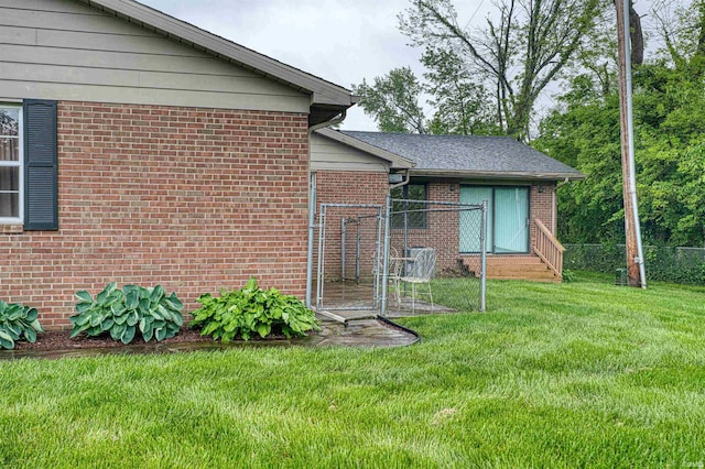 view of side of property featuring brick siding