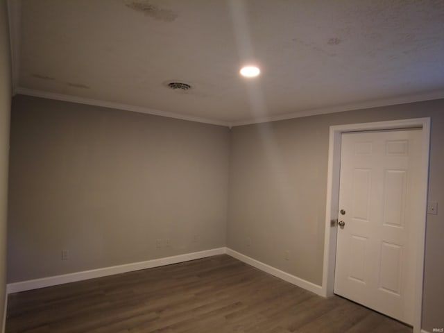 4702 N 37th Hwy, Bedford, IN 47421 - empty room with crown molding, dark wood-style floors, and baseboards