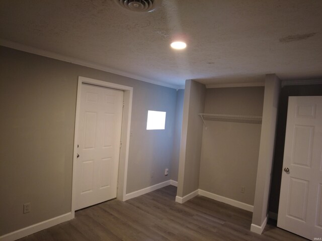 4702 N 37th Hwy, Bedford, IN 47421 - unfurnished bedroom with wood finished floors, crown molding, and baseboards