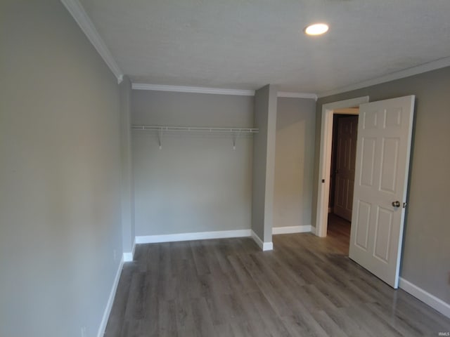 4702 N 37th Hwy, Bedford, IN 47421 - unfurnished bedroom with crown molding, wood finished floors, baseboards, a closet, and recessed lighting