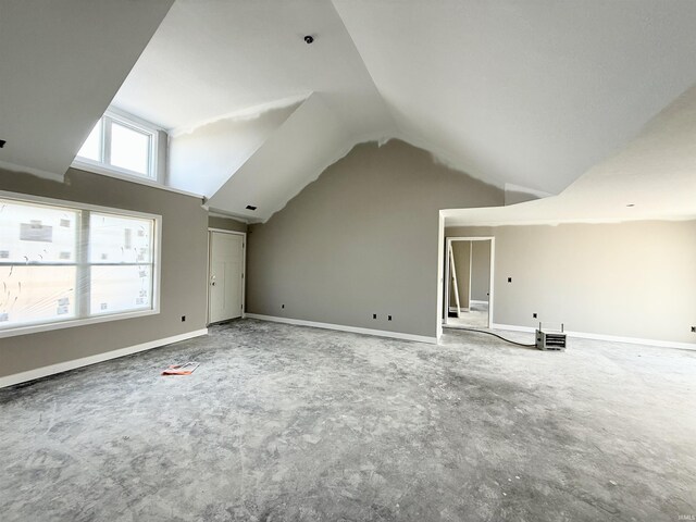 bonus room with carpet, lofted ceiling, and baseboards