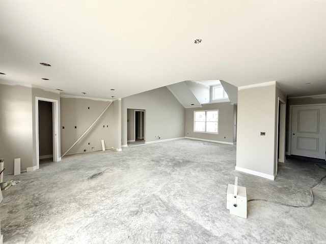 bonus room with light carpet and baseboards