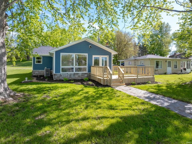 5363 W Warren Ave, Silver Lake, IN 46982 - view of front of home featuring a wooden deck, stone siding, and a front yard