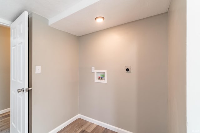 washroom featuring light wood-style flooring, washer hookup, electric dryer hookup, and baseboards