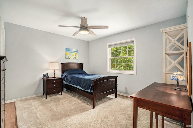 bedroom with baseboards and a ceiling fan