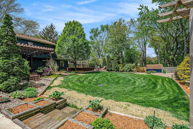 view of yard featuring a garden and a pergola