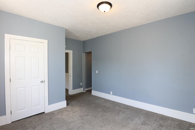 455 E Barner St, Frankfort, IN 46041 - unfurnished bedroom featuring carpet flooring, baseboards, and a textured ceiling