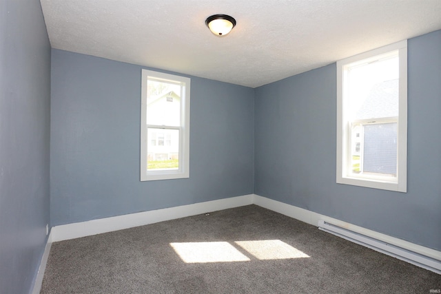 455 E Barner St, Frankfort, IN 46041 - spare room with baseboard heating, carpet floors, a textured ceiling, and baseboards