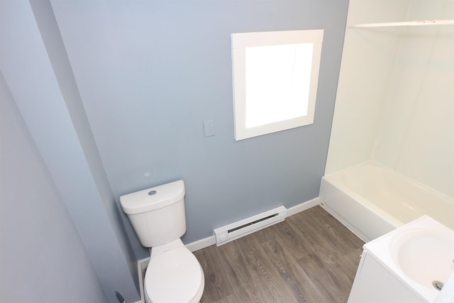 455 E Barner St, Frankfort, IN 46041 - full bath featuring baseboard heating, toilet, wood finished floors, and baseboards