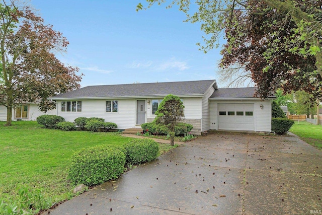single story home featuring an attached garage, concrete driveway, and a front yard