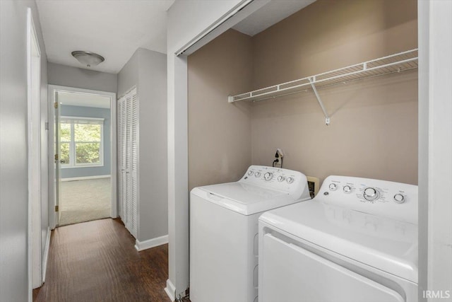laundry room featuring separate washer and dryer, wood finished floors, and baseboards