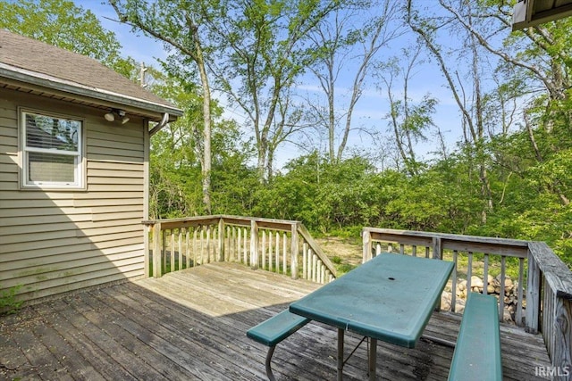 deck featuring outdoor dining area