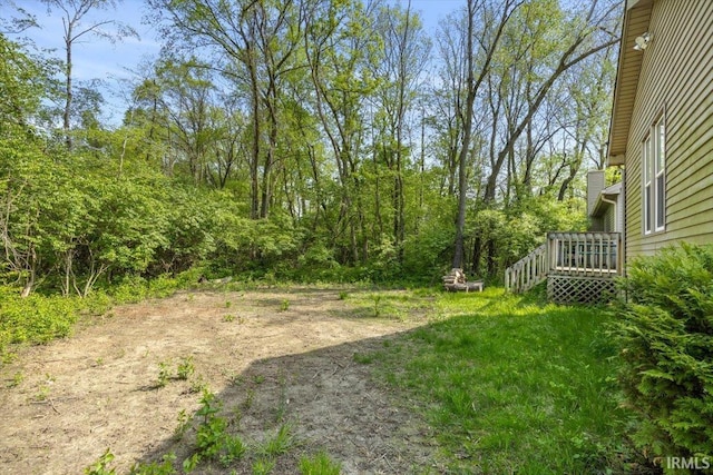 view of yard featuring a wooden deck
