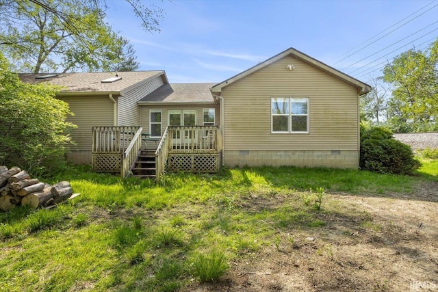 back of property featuring a wooden deck, crawl space, and a shingled roof