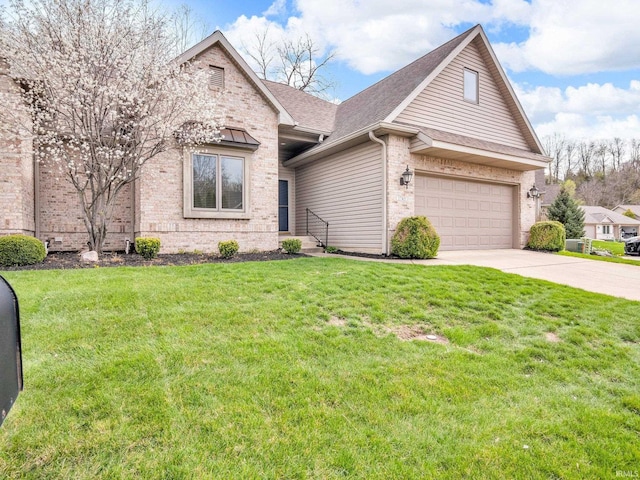 1745 Mill Pond Ln, Lafayette, IN 47905 - view of front of property featuring brick siding, driveway, a garage, a front yard, and roof with shingles