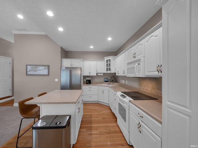 1745 Mill Pond Ln, Lafayette, IN 47905 - kitchen featuring white appliances, a kitchen bar, ornamental molding, recessed lighting, and a sink