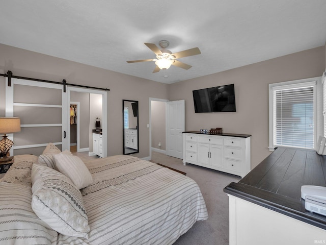 1745 Mill Pond Ln, Lafayette, IN 47905 - carpeted bedroom with a barn door, baseboards, and a ceiling fan