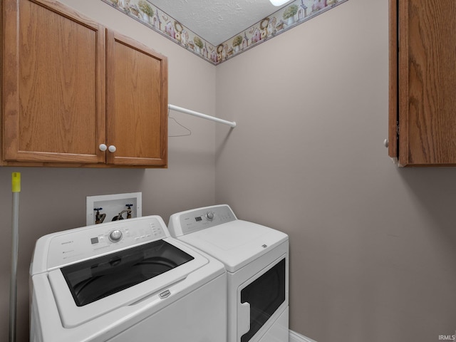 1745 Mill Pond Ln, Lafayette, IN 47905 - laundry area with washing machine and dryer, cabinet space, and a textured ceiling