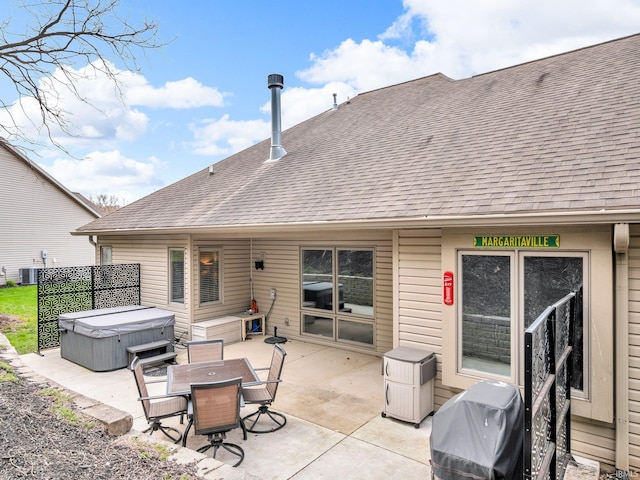 1745 Mill Pond Ln, Lafayette, IN 47905 - back of property featuring a hot tub, a shingled roof, a patio area, central air condition unit, and outdoor dining space