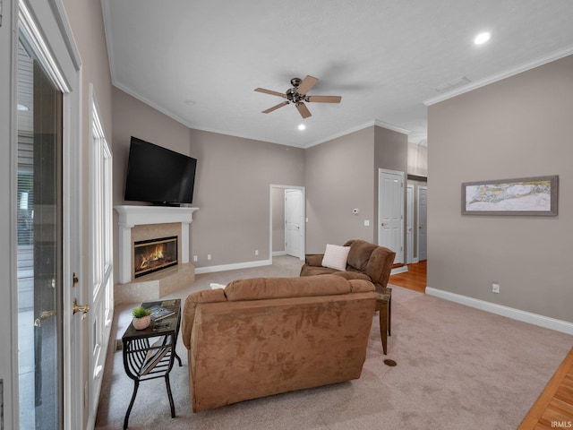 1745 Mill Pond Ln, Lafayette, IN 47905 - carpeted living room featuring a ceiling fan, ornamental molding, baseboards, a glass covered fireplace, and recessed lighting