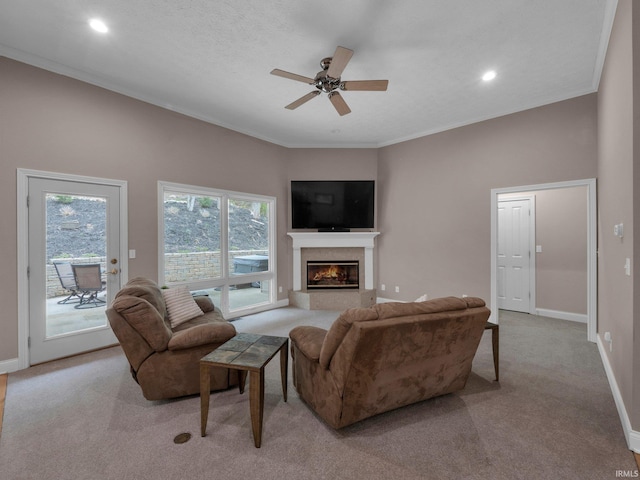 1745 Mill Pond Ln, Lafayette, IN 47905 - living room featuring light carpet, baseboards, a glass covered fireplace, ceiling fan, and ornamental molding