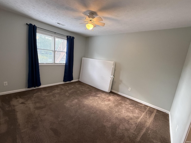 9607 S Lake Ridge Dr, Bloomington, IN 47401 - carpeted spare room featuring a textured ceiling, ceiling fan, and baseboards