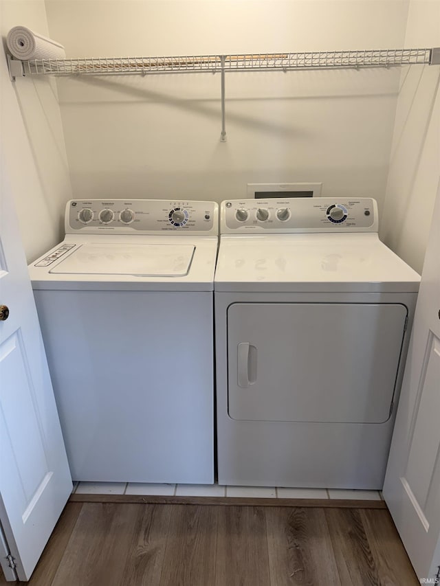 9607 S Lake Ridge Dr, Bloomington, IN 47401 - laundry area with washing machine and clothes dryer and dark wood-style floors