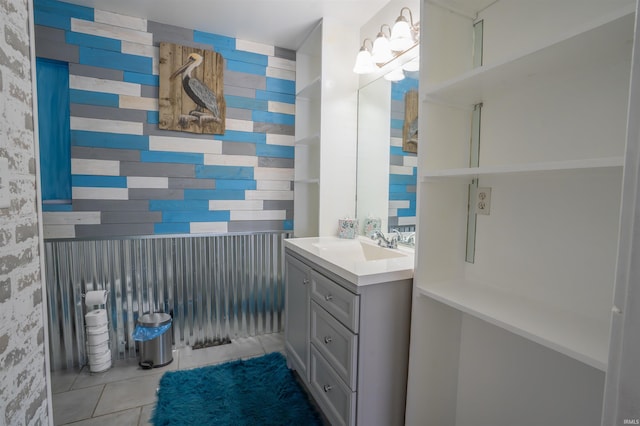 bathroom featuring tile patterned flooring and vanity