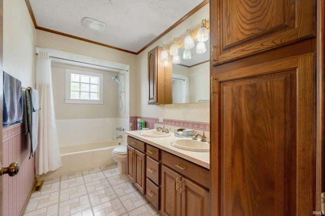 full bath featuring crown molding, toilet, shower / bath combo, double vanity, and a textured ceiling