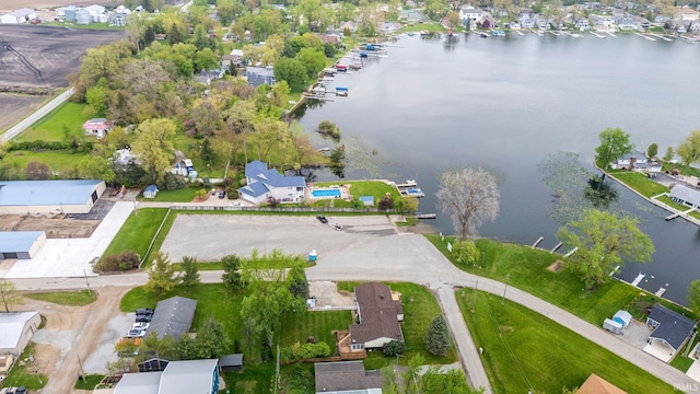 aerial overview of property's location with a large body of water and nearby suburban area
