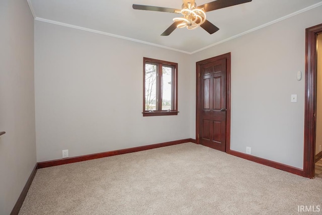 6318 Peacock Ln, Evansville, IN 47715 - spare room with carpet flooring, baseboards, ceiling fan, and ornamental molding