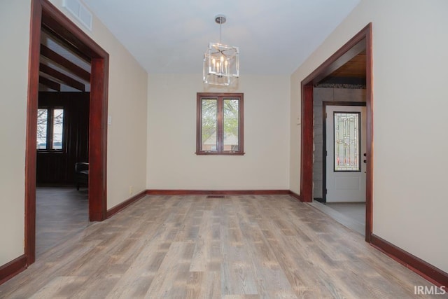 6318 Peacock Ln, Evansville, IN 47715 - spare room featuring light wood-style floors, baseboards, and healthy amount of natural light